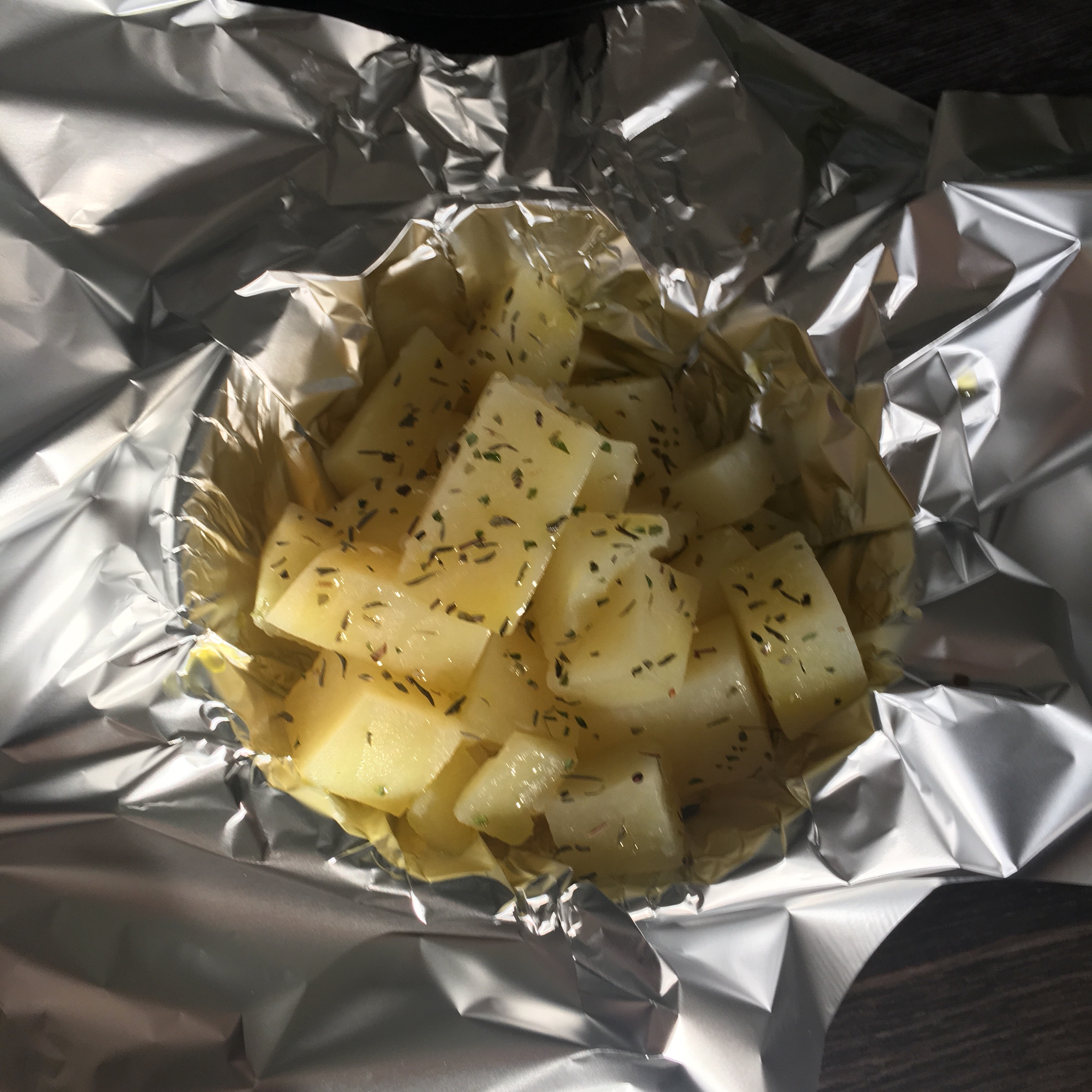 Boiled potatoes with mixed herbs and olive oil